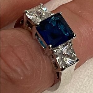 925 stamped ring with blue and clear stones.